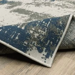 Trinity Modern Distressed Abstract Patio Area Rug Beige/Blue - Captiv8e Designs -Online Home Decoration GUEST 69bea875 354f 4e79 a476 91f7657dc401