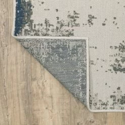 Trinity Modern Distressed Abstract Patio Area Rug Beige/Blue - Captiv8e Designs -Online Home Decoration GUEST 78025ae6 ad6d 4e3a a5d2 2007b50eb263